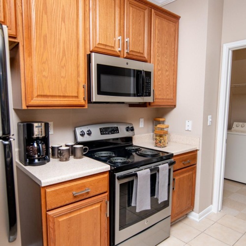 a kitchen with wooden cabinets